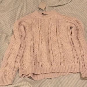 A knit pale lavender/ pink color sweater.